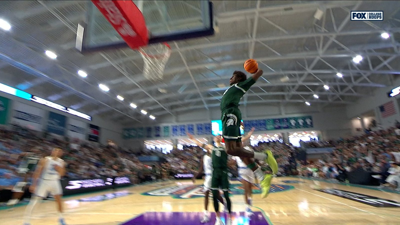 Michigan State039s Coen Carr throws down vicious fast break dunk vs